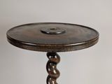 a small table with a wooden top and a metal base