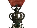 une image d'une médaille avec un ruban rouge sur fond blanc