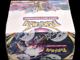 a box of pokemon trading cards on a table