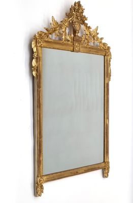 Miroir en bois et stuc doré à décor d'un vase fleuri. - Photo 1