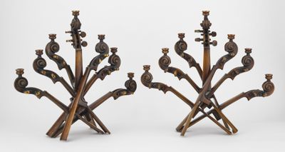 pair of brass candlesticks with birds and flowers on them