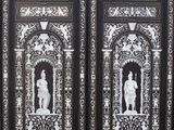 an image of a black and white door with a clock on it