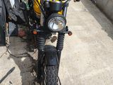 a motorcycle that is parked on the side of the road