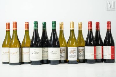 many bottles of wine lined up on a table