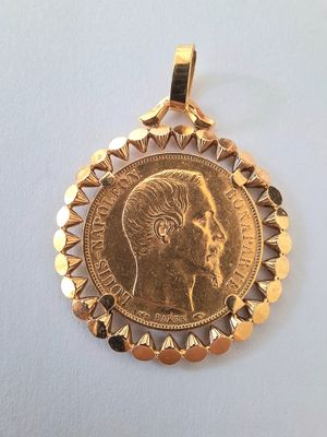 a close up of a gold coin with a woman ' s face on it