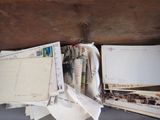a wooden box with a bunch of mail inside of it