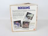 the box is open to show the contents of a doll ' s doll house