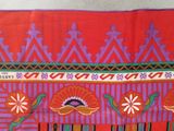 a red and purple cloth with a design on it