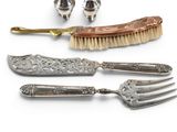four different types of silverware including a fork, knife, and spoon