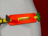 an orange belt with a yellow tag on it