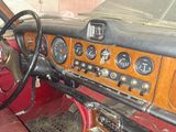 a dashboard of an old car with many gauges on it