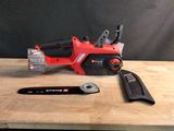 a picture of a cordless saw and a tool on a table