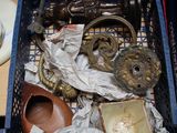 a basket full of antique items on a table