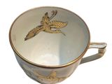 a coffee cup with a bird on it on a white background