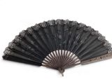 a black fan that is sitting on a white surface