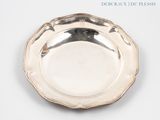 a silver plate that is sitting on a table