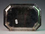 a silver tray that has a tag on it