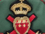 an image of a green hat with a red heart and a crown on it