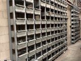 a lot of shelves that are in a warehouse