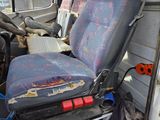 a seat in the back of a truck that has been vandalized