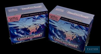 they are two boxes of pokemon cards on a black background