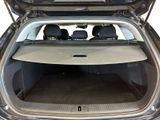 the back of a car with the trunk open and the seats down