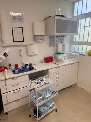 an image of a hospital room with a sink and medical equipment