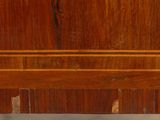 a wooden shelf with a clock on top of it