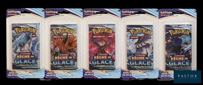 four packs of pokemon trading cards are shown in a row