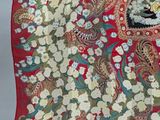 an image of a red scarf with a floral design