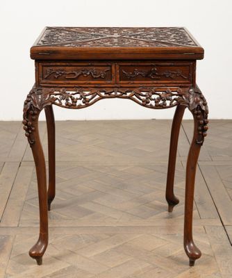 an old wooden table with a drawer on top of it