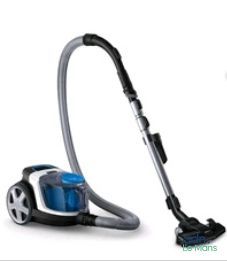 un aspirateur posé par terre à côté d'un bidon