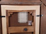 a cat that is sitting inside of a cat house
