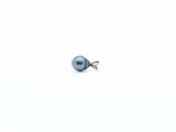 an image of a single pearl on a white surface
