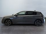 a grey bmw i3 is parked in a room with a white wall