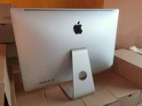 a white apple computer sitting on top of a cardboard box