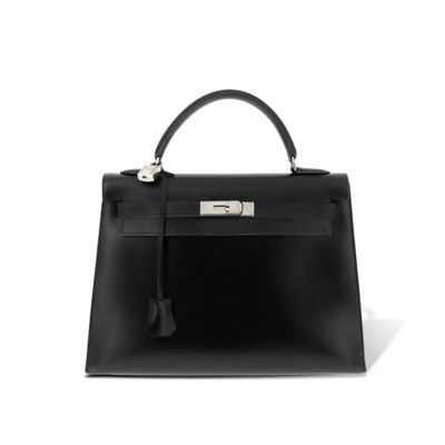 a black leather handbag on a white background