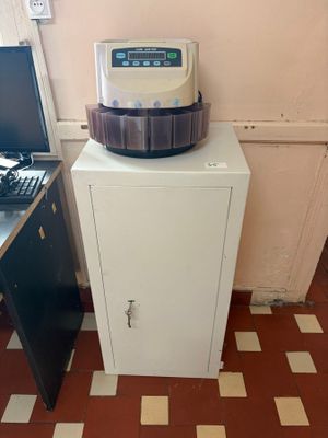 a machine that is sitting on top of a cabinet