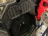 a trash can sitting next to a trash can and a trash can