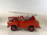 a red toy fire truck with a ladder on top of it