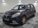 a picture of a small grey car parked in a garage