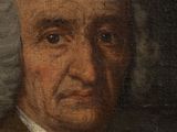 portrait of a man in a brown coat and white hair