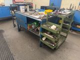 a workbench that has a lot of tools on it