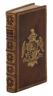 un vieux livre avec un blason sur la couverture