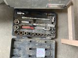 a tool kit that is sitting on the floor