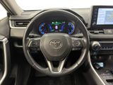 the interior of a car with a steering wheel, dashboard, and display screen