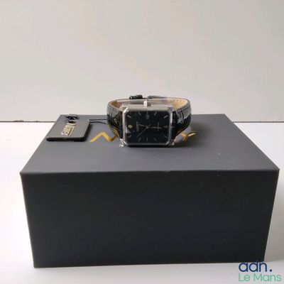 a watch that is sitting on top of a box