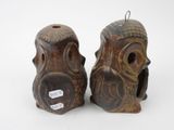 two owl figurines sitting next to each other on a white surface