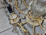 a chandelier that is sitting on a tile floor