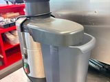 a juicer that is sitting on a counter in a kitchen